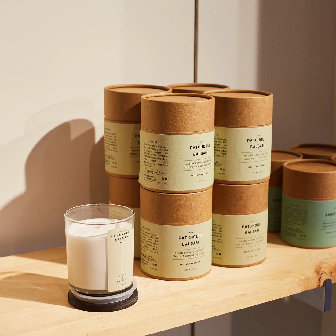 Meet Haus Candles on a shelf in our tube packaging