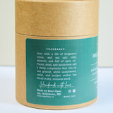 Meet Haus Fells Point soy candle, a Baltimore neighborhood scent: side of the kraft tube box listing notes of bergamot, citrus, sea salt, peony, mint, mushroom, sandalwood, cedar and juniper, made in Baltimore, MD.